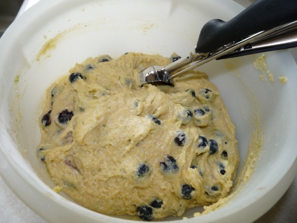Use a scoop to fill 12 muffin cups