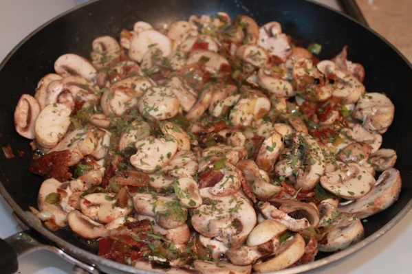 Add mushrooms, sherry or red wine vinegar, tarragon, salt and pepper