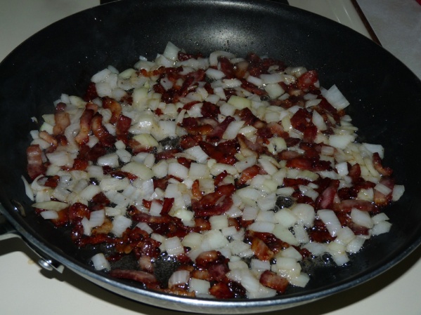 Brown bacon and onion in a skillet