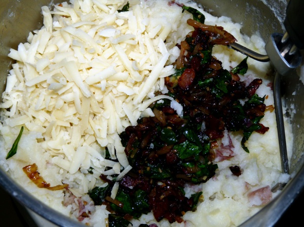Mash in bacon scallions mixture and shredded cheese