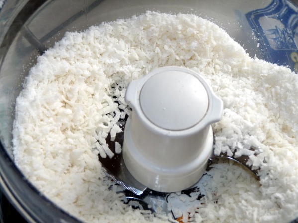 Pulse coconut in a food processor or blender until smaller pieces