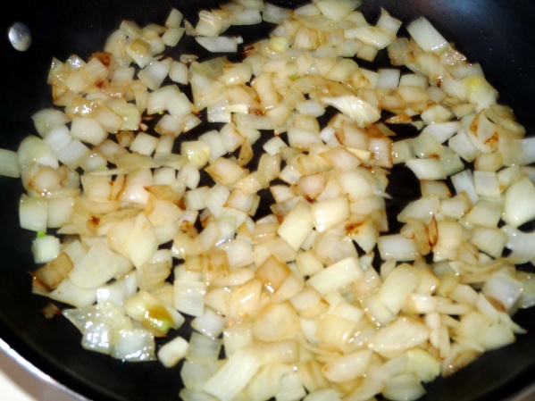 Saute onions with a light shake of salt until browned around the edges. Place onions in crockpot