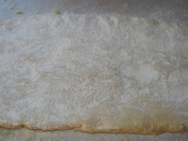 Work dough until evenly mixed, form into rectangle about 1" thick. Cut into 1" strips, roll and cut into 3/4" pieces. Use a fork or gnocchi board to roll indentions. Boil in salted water until they float. Remove and cool in a single layer.