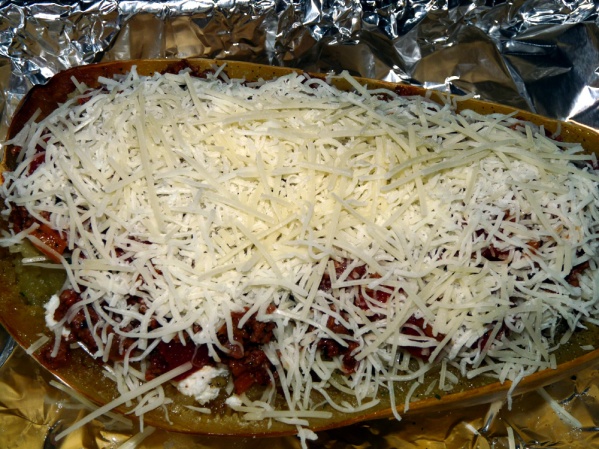 Repeat layers one more time and top with a third layer of Parmesan and mozzarella