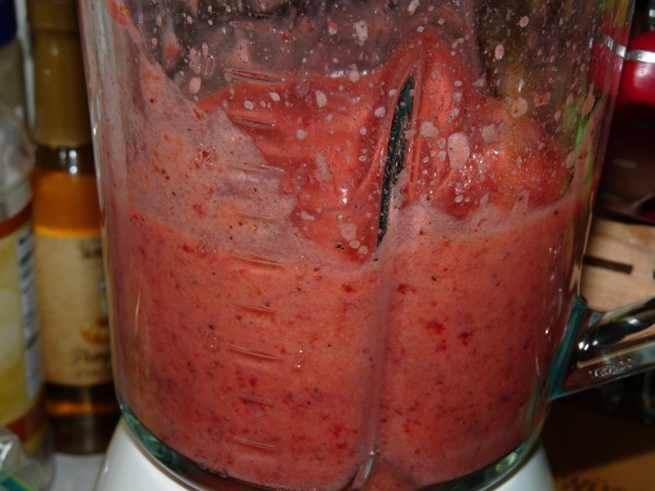 Pulse and blend, pushing strawberries down and scraping sides until smooth.