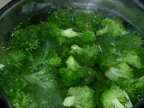Blanch broccoli florets in boiling water then a cold bath.
