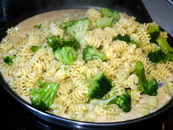 Drain pasta and broccoli, reserving several cups of pasta water. Add pasta and broccoli to sauce and stir to coat.