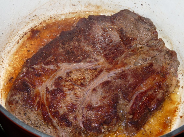 Sear roast on all sides in a Dutch oven over medium high heat in a drizzle of oil.