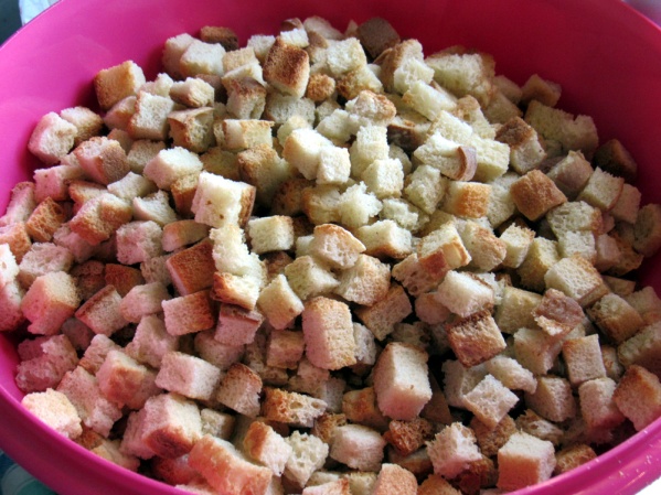 When ready to make stuffing, pour bread cubes into large bowl. Add seasonings and mix.